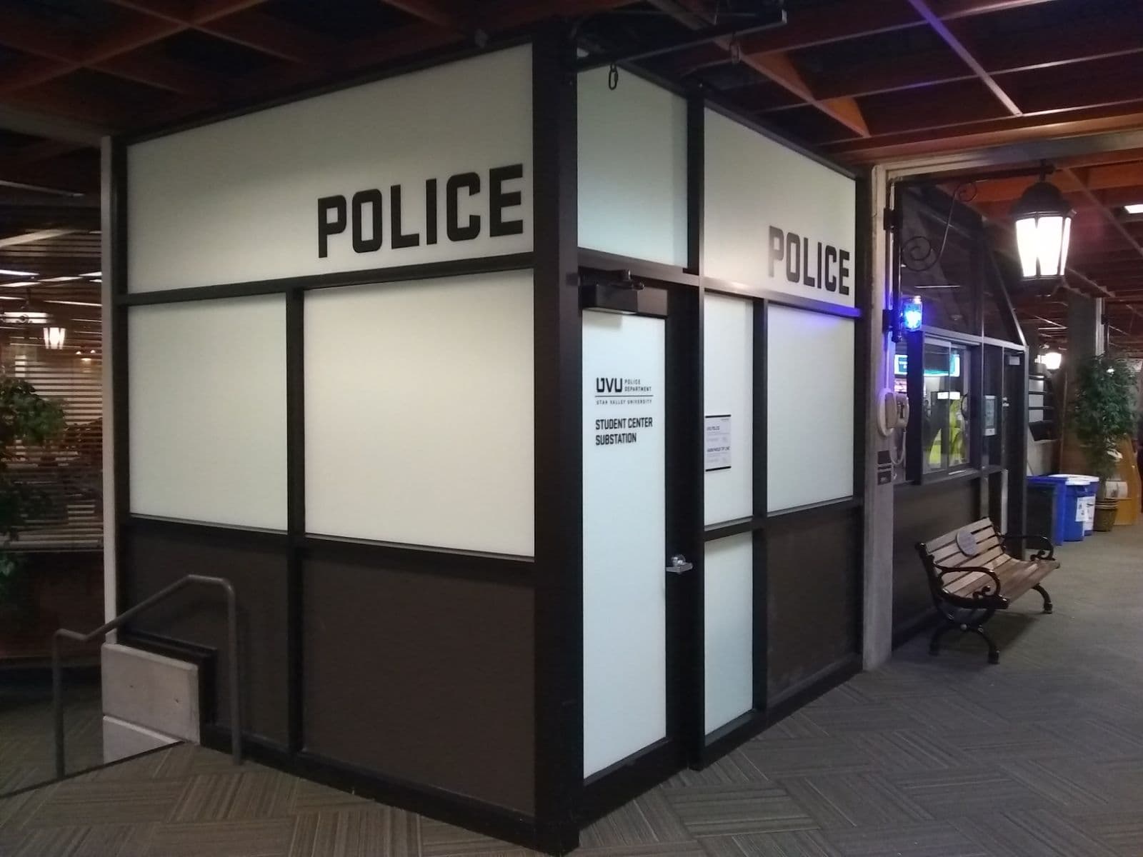 UVU Police Department student center substation featuring frosted glass panels and bold vinyl signage.