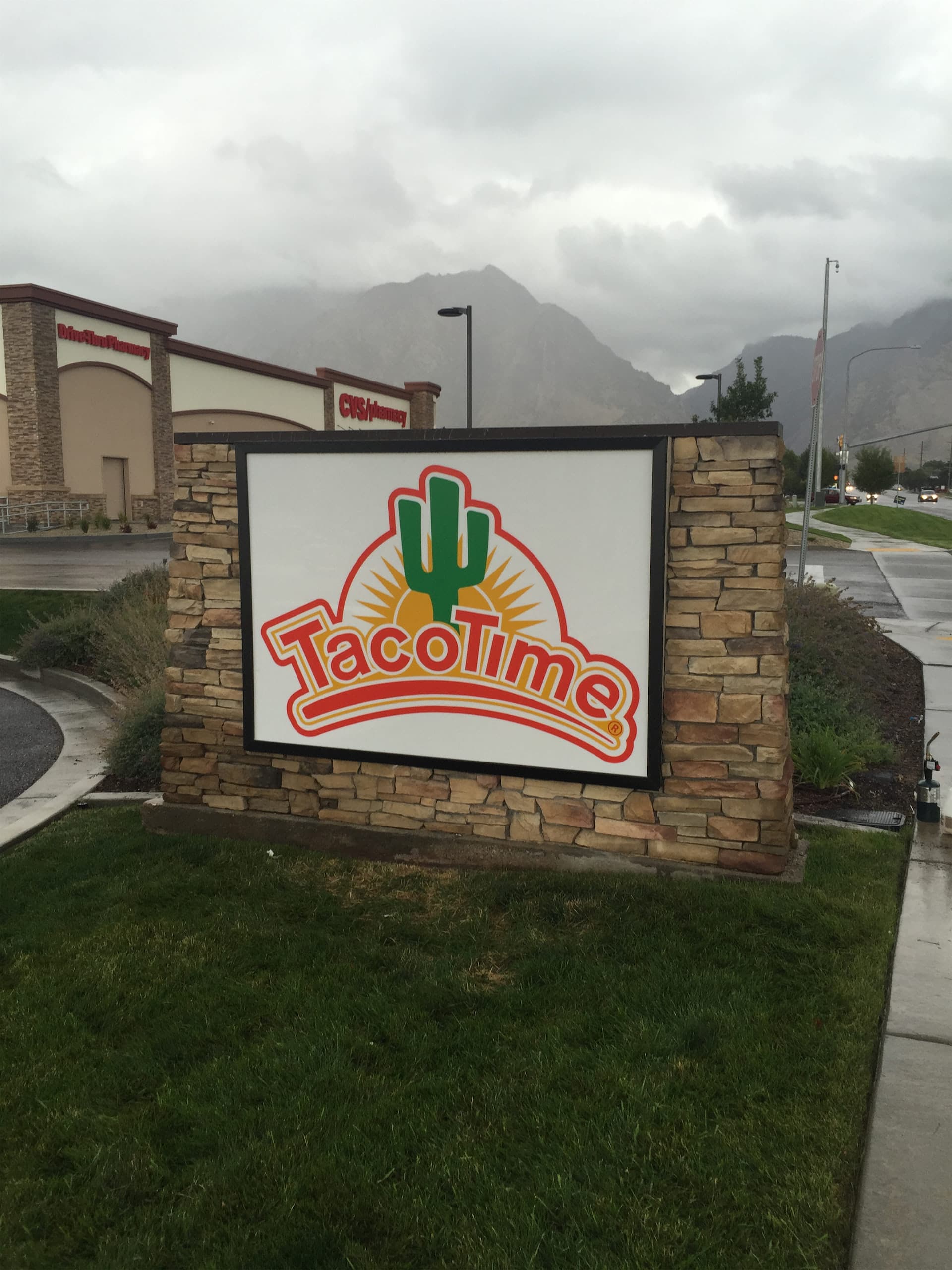 Taco Time outdoor monument sign built into a stone masonry border.