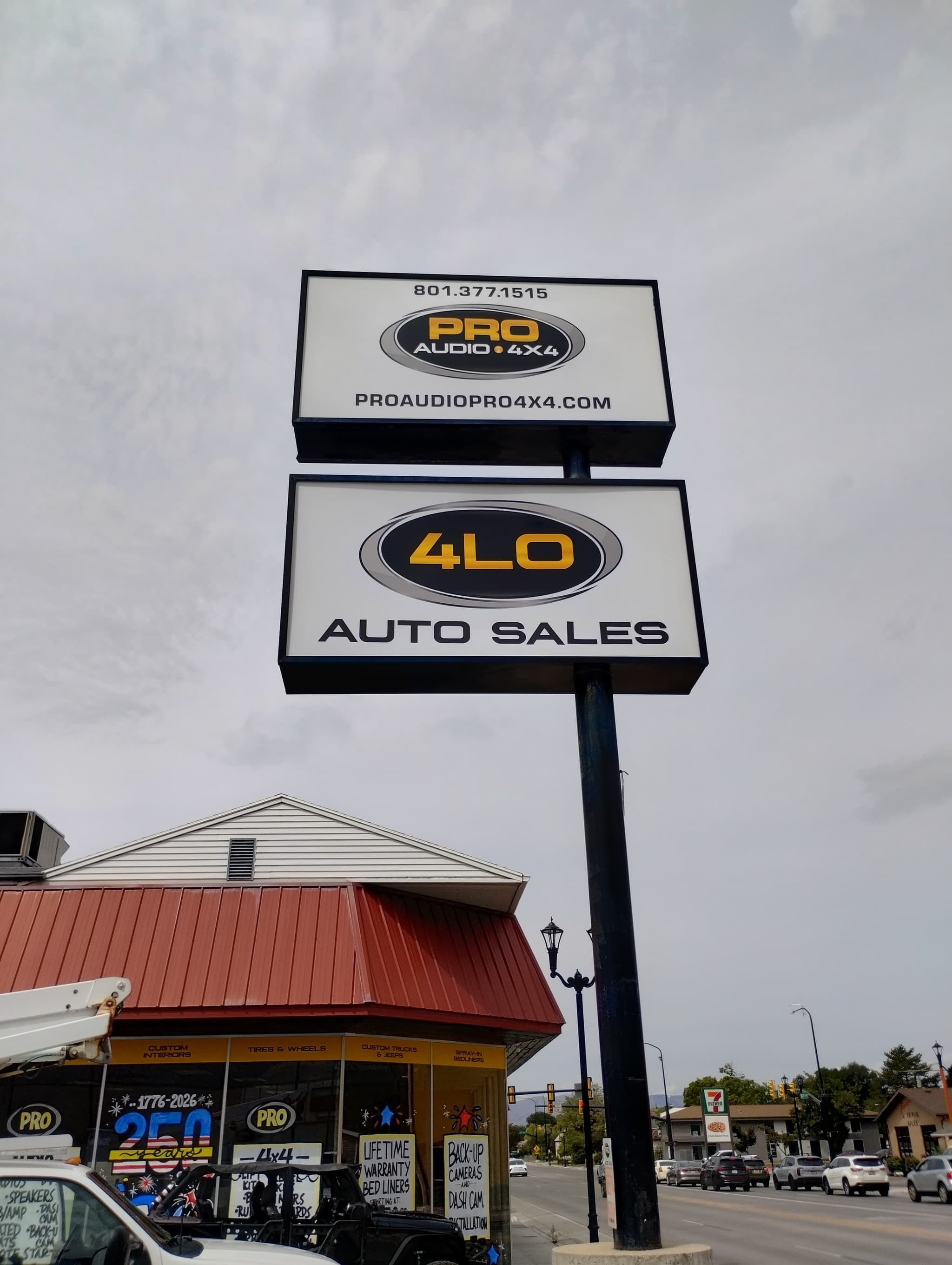 Outdoor double-stacked pylon sign for Pro Audio 4x4 and 4LO Auto Sales.