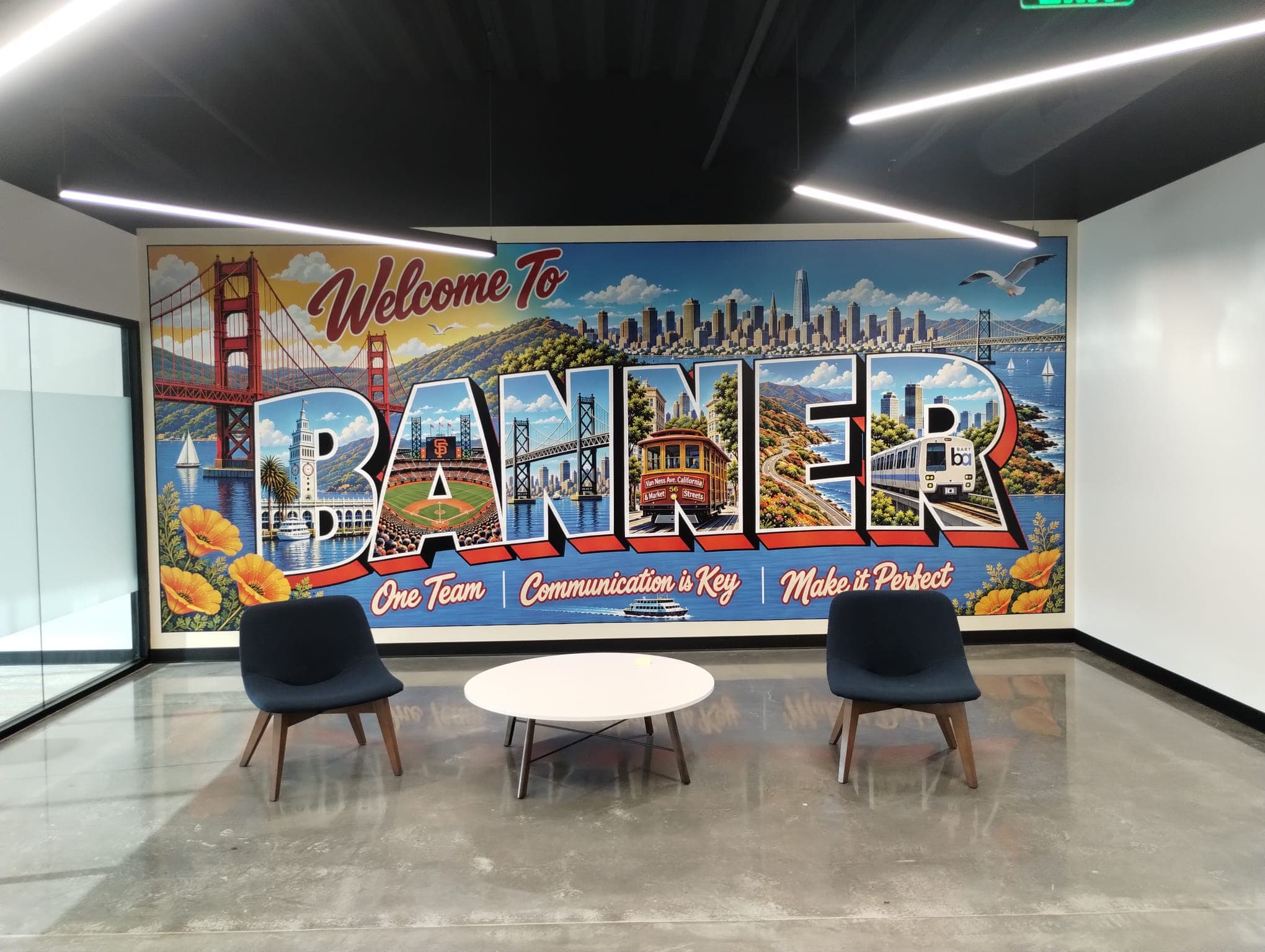 San Francisco postcard style wall mural reading Welcome to Banner in a modern office seating area.
